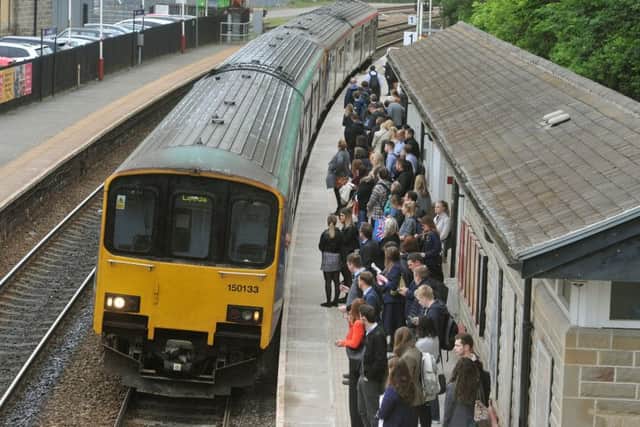 Commuters get on the 8.08 am train from Horsforth to Leeds Station. PIC: Tony Johnson