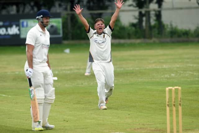 Pudsey's Charlie Parker appeals unsuccessfully for the wicket of Hanging Heaton's Nick Connolly. PIC: Jonathan Gawthorpe