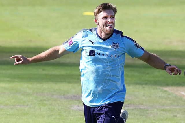 Yorkshire's David Willey celebrates taking the wicket of Lancashires Haseeb Hameed.