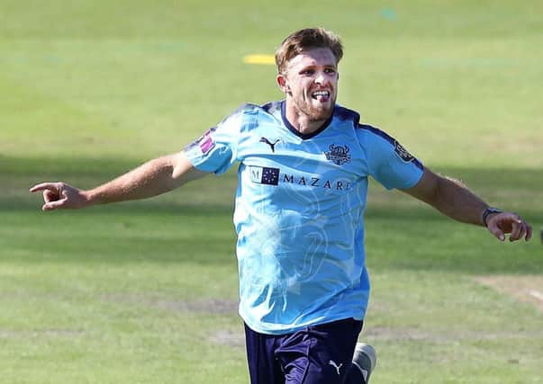 Yorkshire's David Willey celebrates taking the wicket of Lancashires Haseeb Hameed.