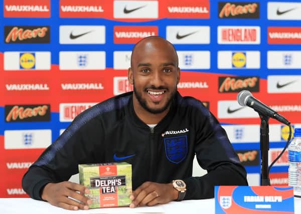 England's Fabian Delph is presented with a box of Delph's Tea during the media day at St George's Park, Burton.