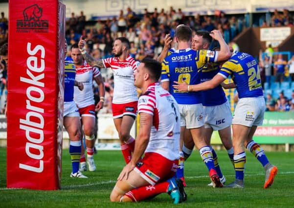 Jack Walker celebrates with team-mates after scoring against Leigh.