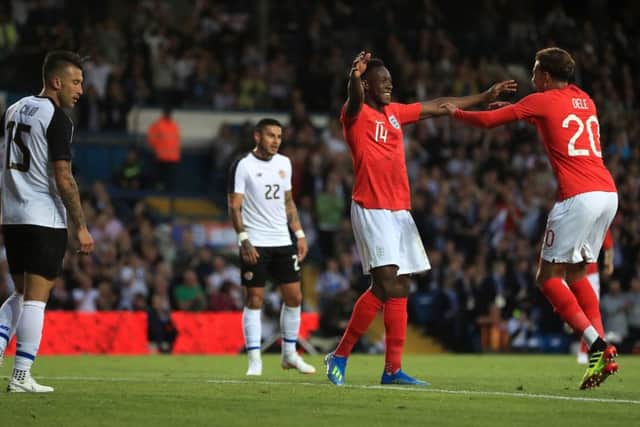 England's Danny Welbeck (centre) celebrates scoring his side's second goal of the game with team-mate Dele Alli during the International Friendly match at Elland Road. PIC: Mike Egerton/PA Wire