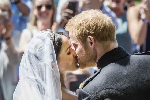Meghan Markle and Prince Harry kiss on the steps of St George's Chapel at Windsor Castle following their wedding. Photo: Danny Lawson/PA Wire