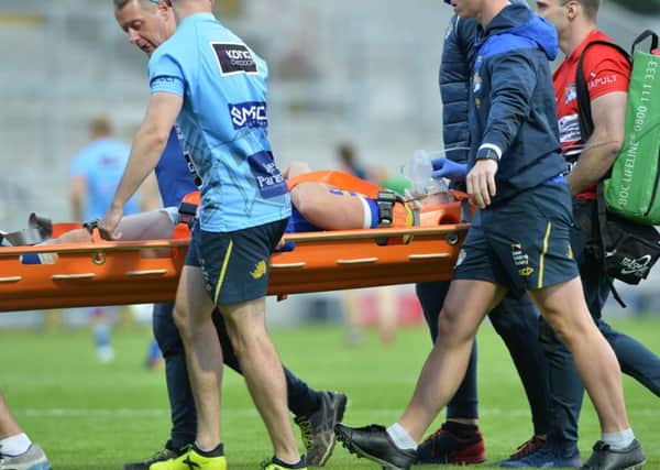Mikolaj Oledzki is stretchered off after suffering a head injury.