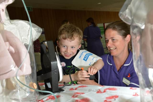 St James Hospital celebrating the NHS turning 70 and the 10 year anniversary of Bexley Wing opening.
Pictured Sam Lowey, 5, has his blood pressure checked by Clinical Educator Deborah Rowett.
9 June 2018.  Picture Bruce Rollinson
