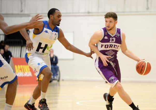 Isaac Mourier battles past Malcolm Riley for Leeds Force against Cheshire Phoenix in the BBL Championship last season.  Picture: Bruce Rollinson
