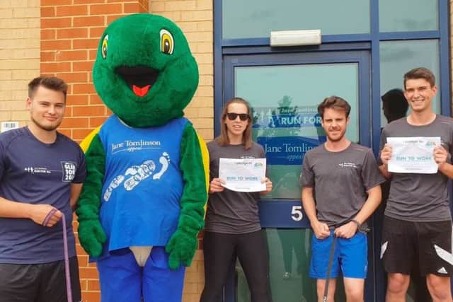GET SET: Run For All staff and Tommo, the mascot of the Jane Tomlinson Appeal, promoting run to work.