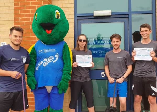 GET SET: Run For All staff and Tommo, the mascot of the Jane Tomlinson Appeal, promoting run to work.