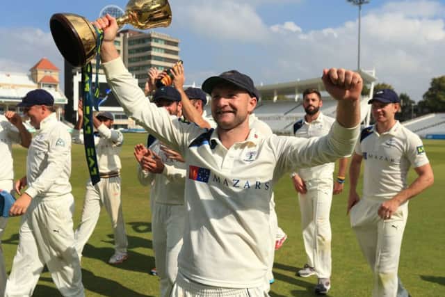 LOTTERY: Yorkshire's Adam Lyth and his team-mates celebrate winning the Division One County Championship at Trent Bridge, in 2014. Picture: Mike Egerton/PA.