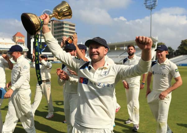 LOTTERY: Yorkshire's Adam Lyth and his team-mates celebrate winning the Division One County Championship at Trent Bridge, in 2014. Picture: Mike Egerton/PA.