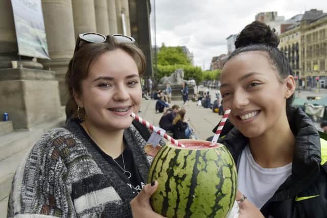 Great Yorkshire Vegan Festival at Leeds Town Hall 16th and 17th June 2018. Friends Eve Wright, 16 and Kyrah, 15 share a drink at the festival