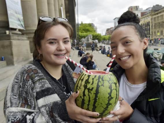 Great Yorkshire Vegan Festival at Leeds Town Hall 16th and 17th June 2018. Friends Eve Wright, 16 and Kyrah, 15 share a drink at the festival