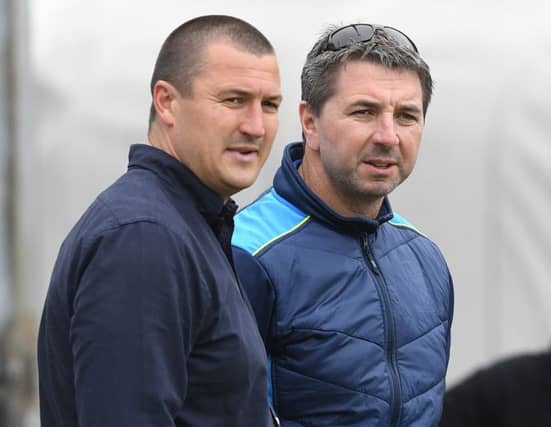 Trinity coach Chris Chester, left.
