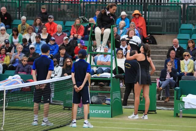 Johanna Konta argues with umpire Paula Vieira Souza during her WTA Singles Final match with Ashleigh Barty at the Nature Valley Open at Nottingham. Picture: Mike Egerton/PA Wire