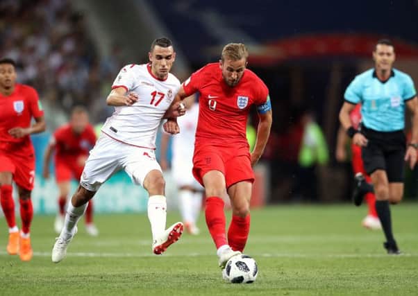 Tunisia's Ellyes Skhiri (left) and England's Harry Kane (right) battle for the ball in Volgograd. Picture: Adam Davy/PA