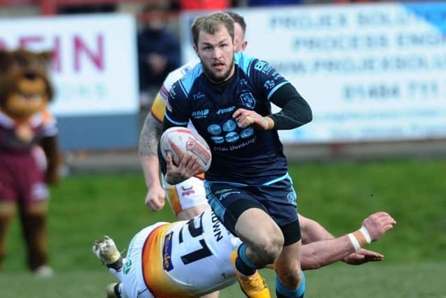 Betfred Championship.
Batley Bulldogs v Featherstone Rovers.
Rovers Luke Briscoe skips away from Batley's James Brown.
24th March 2018.
Picture Jonathan Gawthorpe