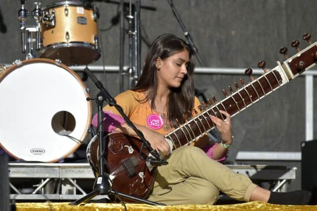 A musician with South Asian Arts performing at a Leeds 2023 bid event.