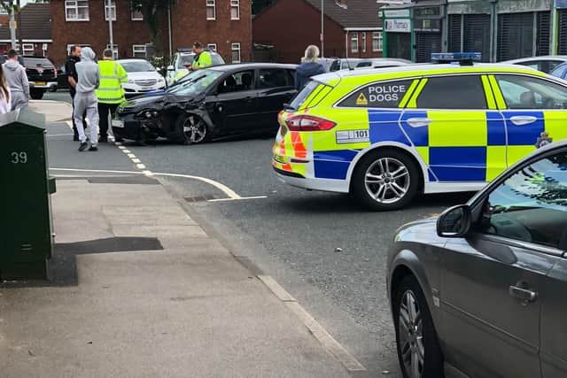 Police in the road with the car involved in the incident