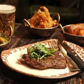 8oz sirloin with sides of triple cooked chips, shredded leaks, onion rings. PIC: Tony Johnson