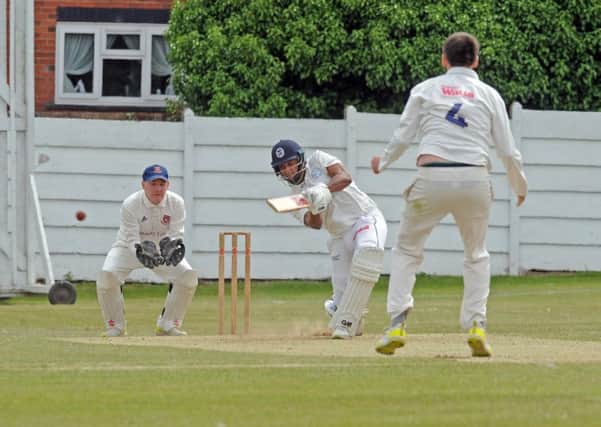 Farsley's overseas batsman Patrick Kruger smashes a boundary from Cleckheaton bowler Andrew Deegan.  Picture: Tony Johnson.
