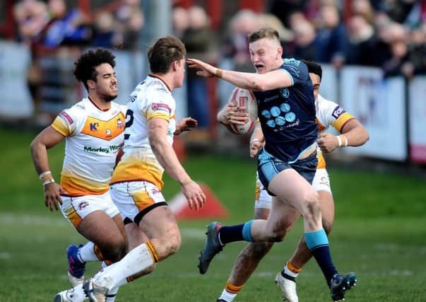 LOAN STAR: Harry Newman gets away from Batley's Keenan Tomlinson while in action for Featherstone Rovers. Picture: Jonathan Gawthorpe
