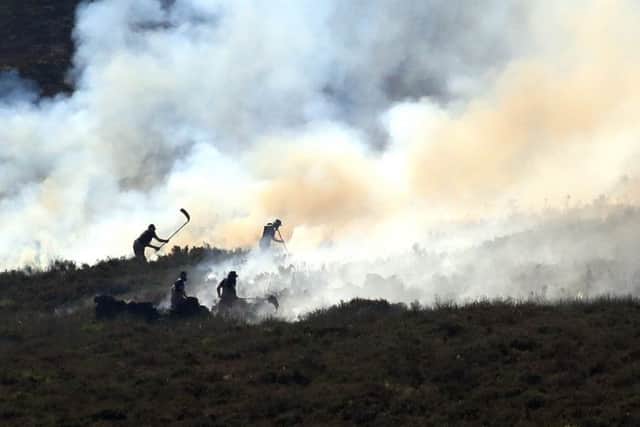 Firefighters tackle the wildfire on Saddleworth Moor which continues to spread after the blaze was declared a major incident by Greater Manchester Police. PRESS ASSOCIATION Photo.