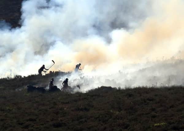 Firefighters tackle the wildfire on Saddleworth Moor which continues to spread after the blaze was declared a major incident by Greater Manchester Police. PRESS ASSOCIATION Photo.