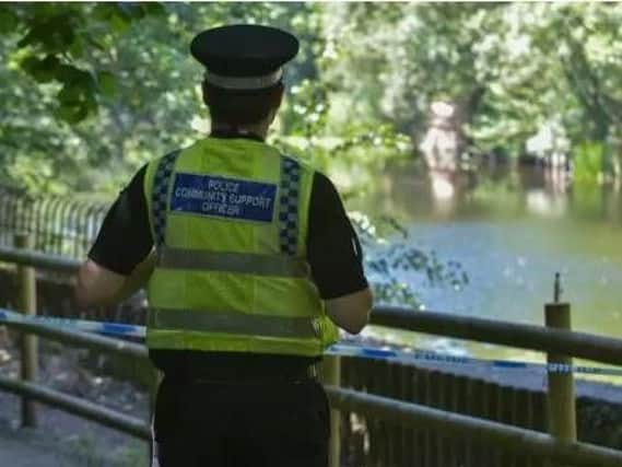 Police at the scene where the body was found, near Kirkstall Road, Leeds. Picture: SWNS.