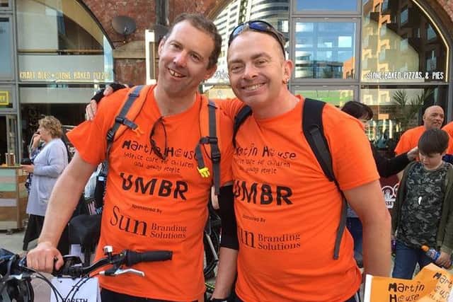 Gareth Fradley and Lee Hebden, both 41, after their 127-mile bike ride along the Leeds-Liverpool canal.