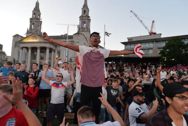 Football Fans watching the Columbia v England World Cup game from the Spartak Stadium in Russia on the large screen in Millennium Square, Leeds, celebrate.3 July 2018.  Picture Bruce Rollinson