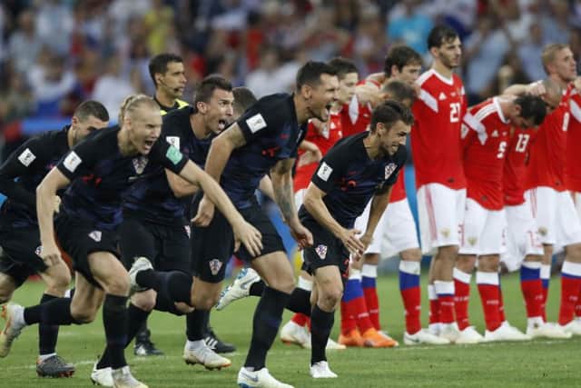 Croatia players celebrate after beating hosts Russia on penalties. Picture: AP/Darko Bandic