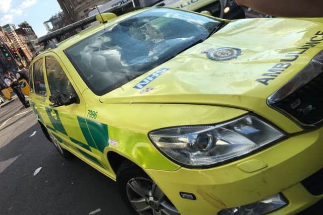 Photo issued by the London Ambulance Service of an emergency response vehicle that was damaged during post match celebrations.