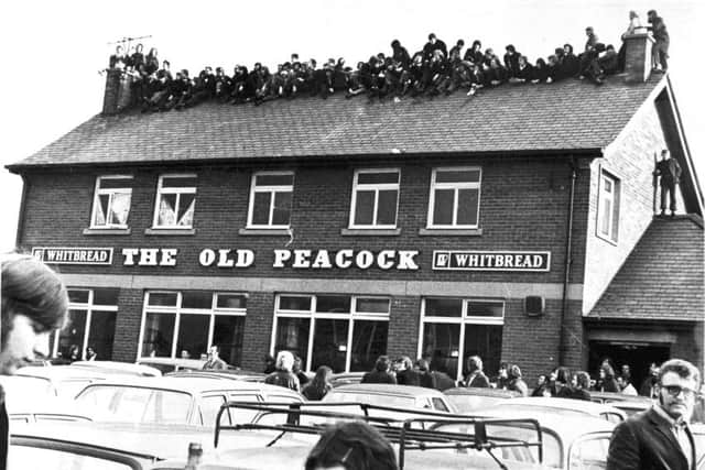 Fans on the roof of the Old Peacock in 1972.