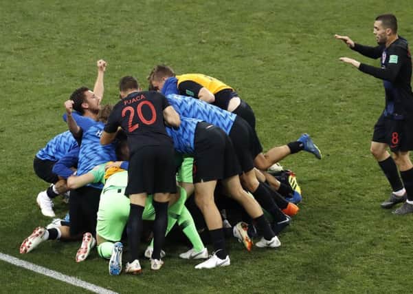 Croatia players celebrate after scoring their second goal against Russia.