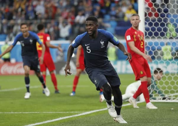 France's Samuel Umtiti celebrates after scoring his side's winning goal against Belgium. Picture: AP/Natacha Pisarenko.