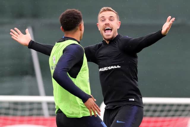 England's Jordan Henderson reacts during a training session