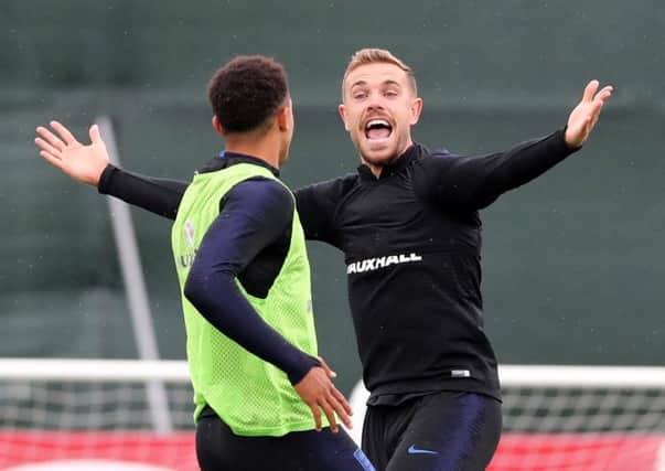 England's Jordan Henderson reacts during a training session