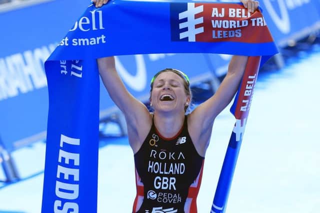 Vicky Holland celebrates winning the elite women's race during the 2018 ITU World Triathlon Series Event in Leeds.