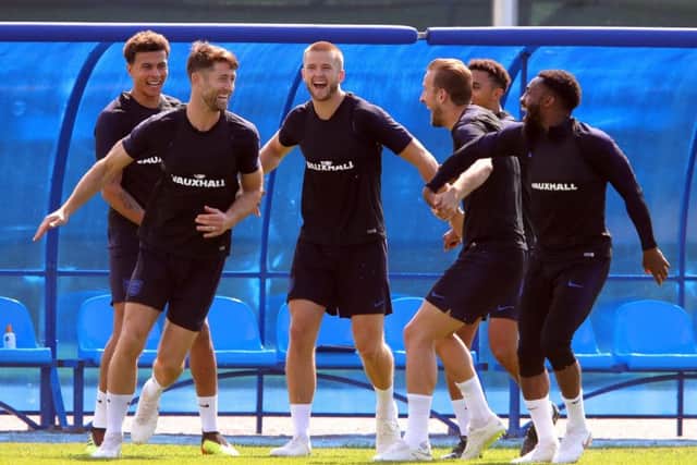 England players, l-r, Dele Alli, Gary Cahill, Eric Dier, captain Harry Kane, Jesse Lingard and Danny Rose share a jovial moment in training at Zelenogorsk Stadium on Friday (Picture: Alexander Hassenstein/Getty Images).