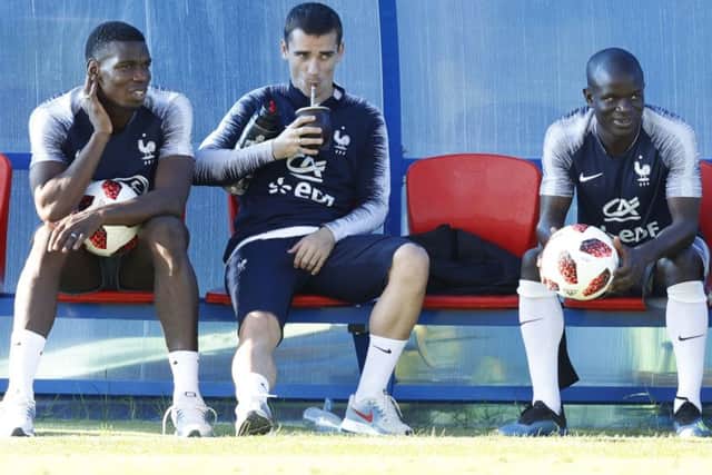 FINAL COUNTDOWN: France's Paul Pogba, Antoine Griezmann and Ngolo Kante take a breather during a training session. Picture: AP/David Vincent)