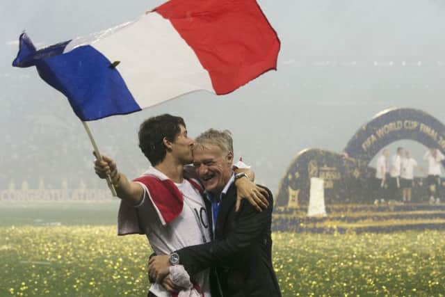 France head coach Didier Deschamps (right) and son Dylan Deschamps celebrate winning the World Cup final at the Luzhniki Stadium in Moscow. Picture: Owen Humphreys/PA .