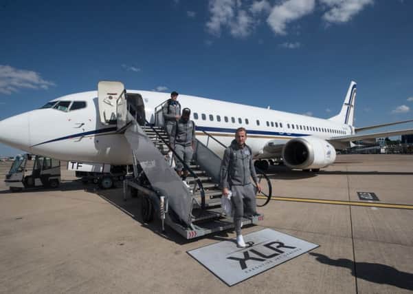 England's Harry Kane, right, Danny Rose, centre, and Phil Jones step off the plane after the team landed at Birmingham Airport (Picture: Eddie Keogh/The FA/PA Wire).
