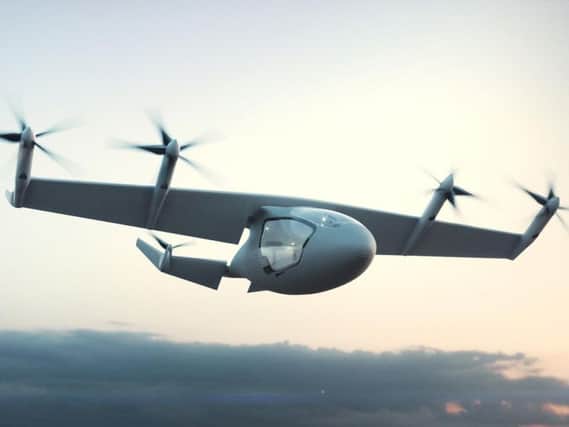 Photo issued by Rolls-Royce PLC of a flying taxi concept which has been unveiled by engine maker. The hybrid vehicle could transport five passengers at speeds of 250mph for up to 500 miles without being recharged. PA