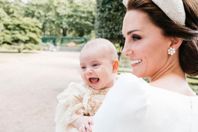 The Duke and Duchess of Cambridge have released this additional photograph taken Monday 9th July by Matt Porteous in the garden at Clarence House, following Prince Louis's baptism at the Chapel Royal, St. James's Palace. PA