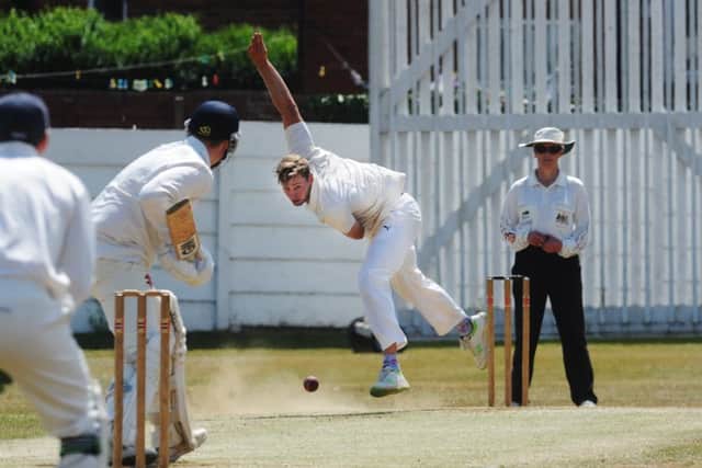 James Wainman, bowling in the dust for Farsley. PIC: Steve Riding