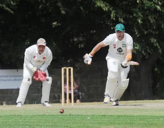 Otley's 
Jamie PIckering, who scored 108, goes on the attack with Ben Morley. Together they put on 132 for the first wicket in the 125-run win over Pool. PIC: Steve Riding