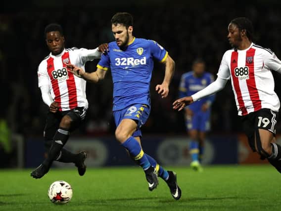Florian Jozefzoon, left, challenges Alfonso Pedraza during Leeds United's game at Brentford in April 2017.