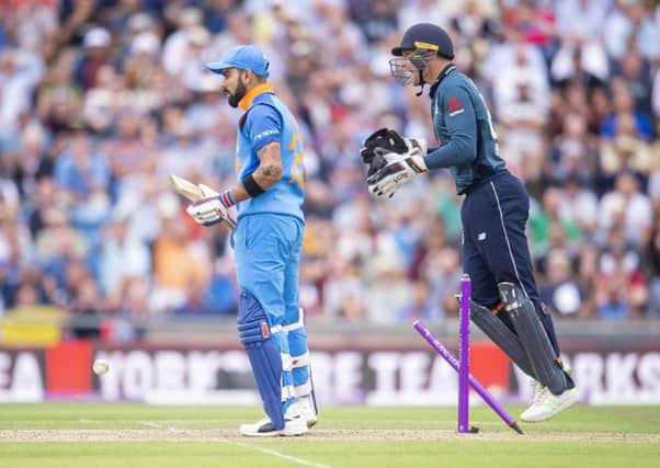 SURPRISE!  India's Virat Kohli is left bemused at Headingley after being bowled by England's Adil Rashid as wicketkeeper Jos Buttler celebrates. Picture: Allan McKenzie/SWpix.com