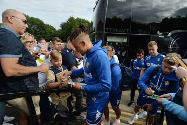 Kalvin Phillips and Gjanni Alioski sign autographs at Forest Green.